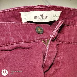 Burgundy Hollister skinny jeans.